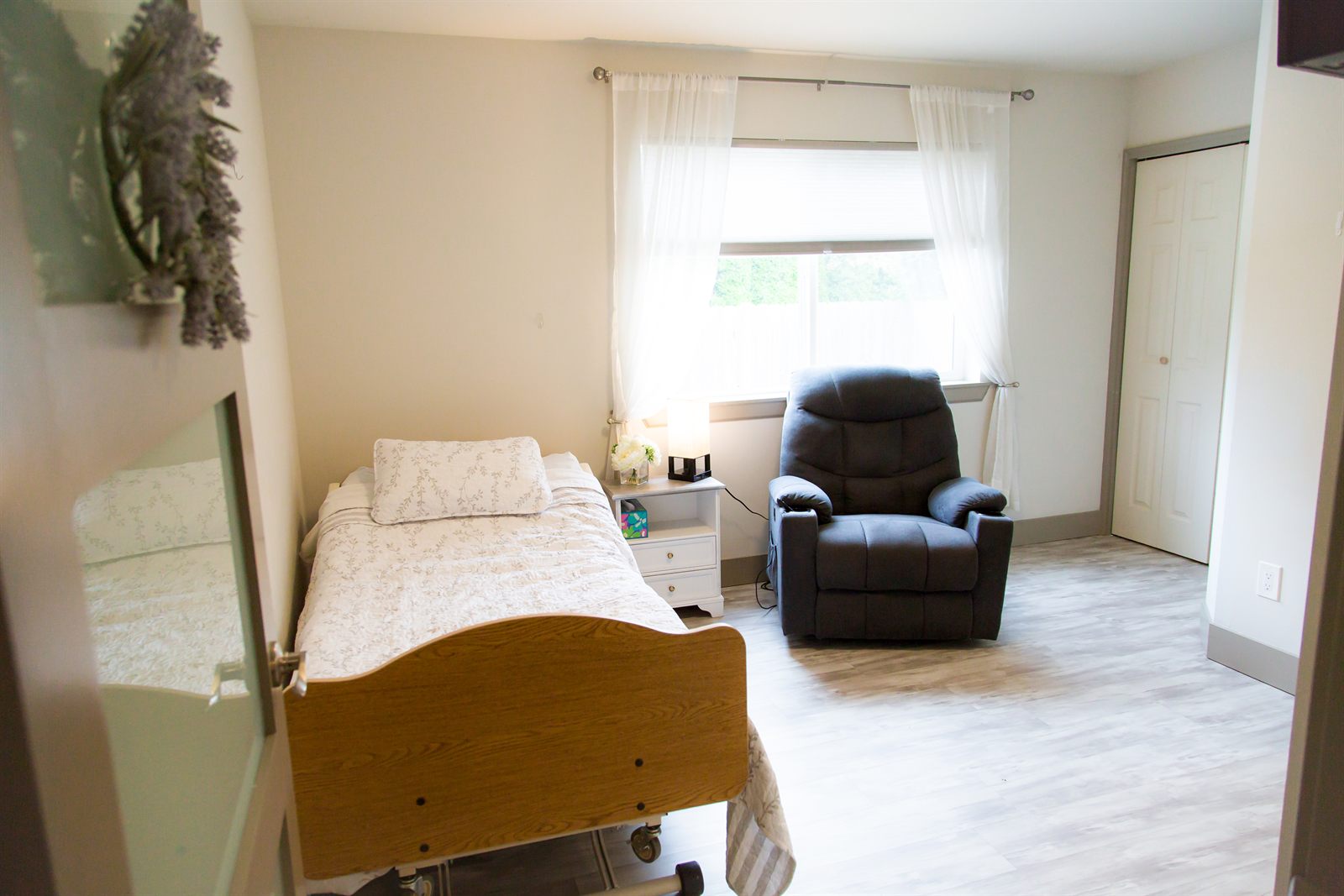 Private bedroom with a recliner beside the window