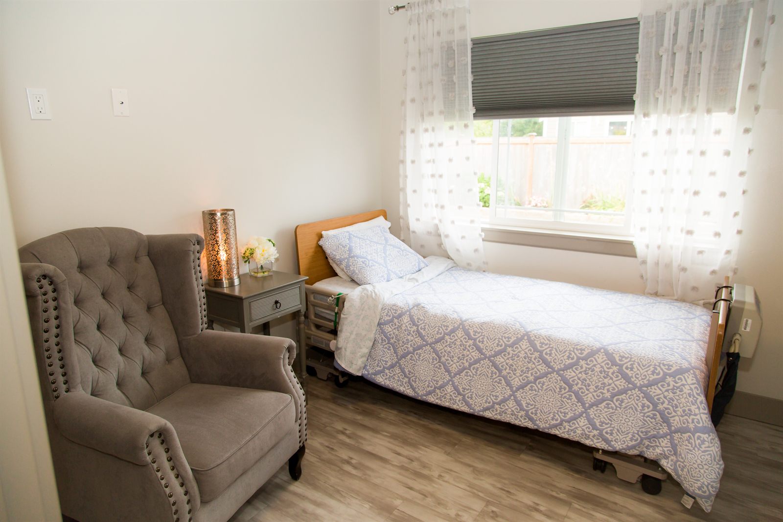 Private bedroom with a large window and an armchair