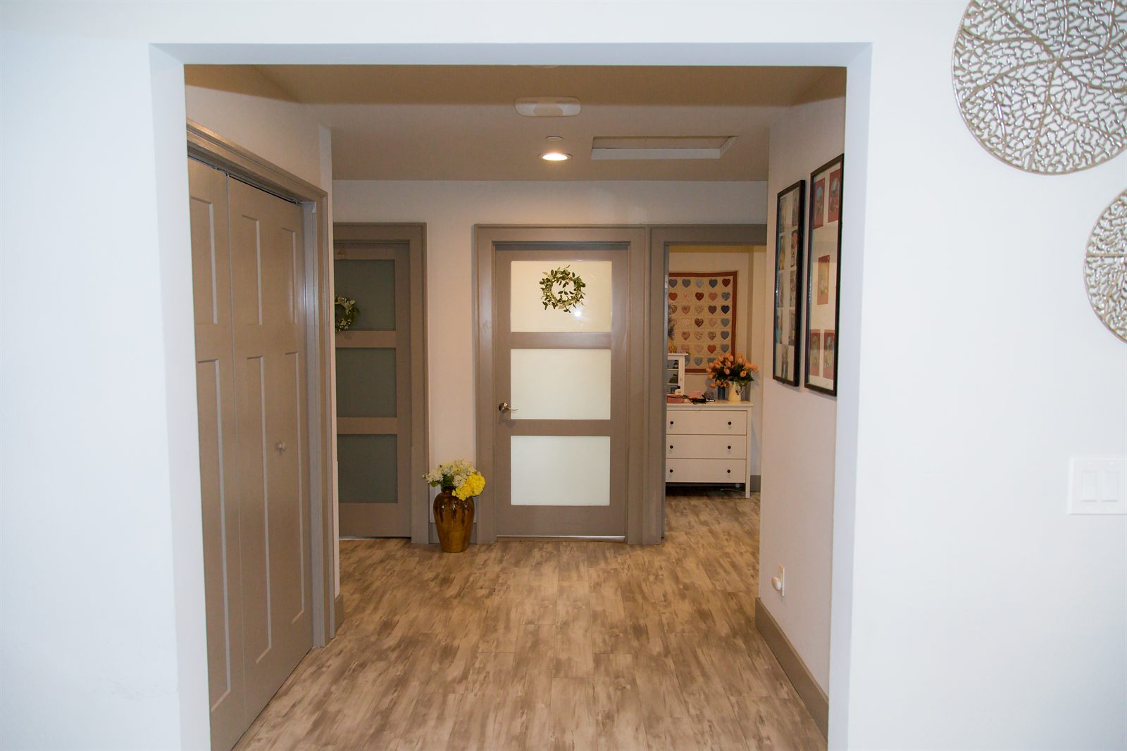 Entry hallway with wide doorways and natural light