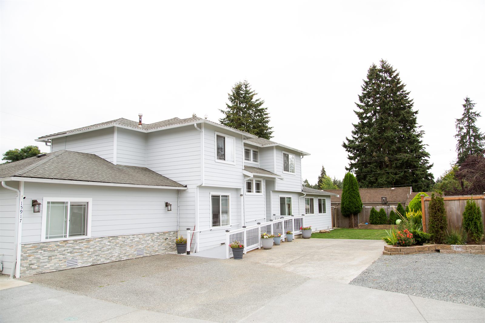 Side of the home with the ramped entrance and parking area