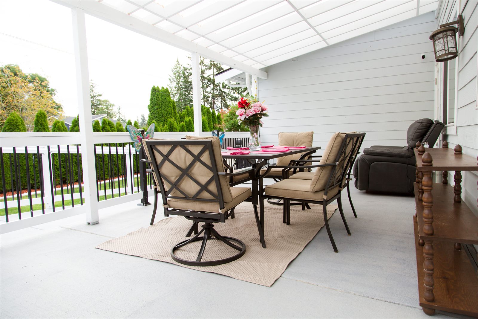 Covered patio seating overlooking the garden