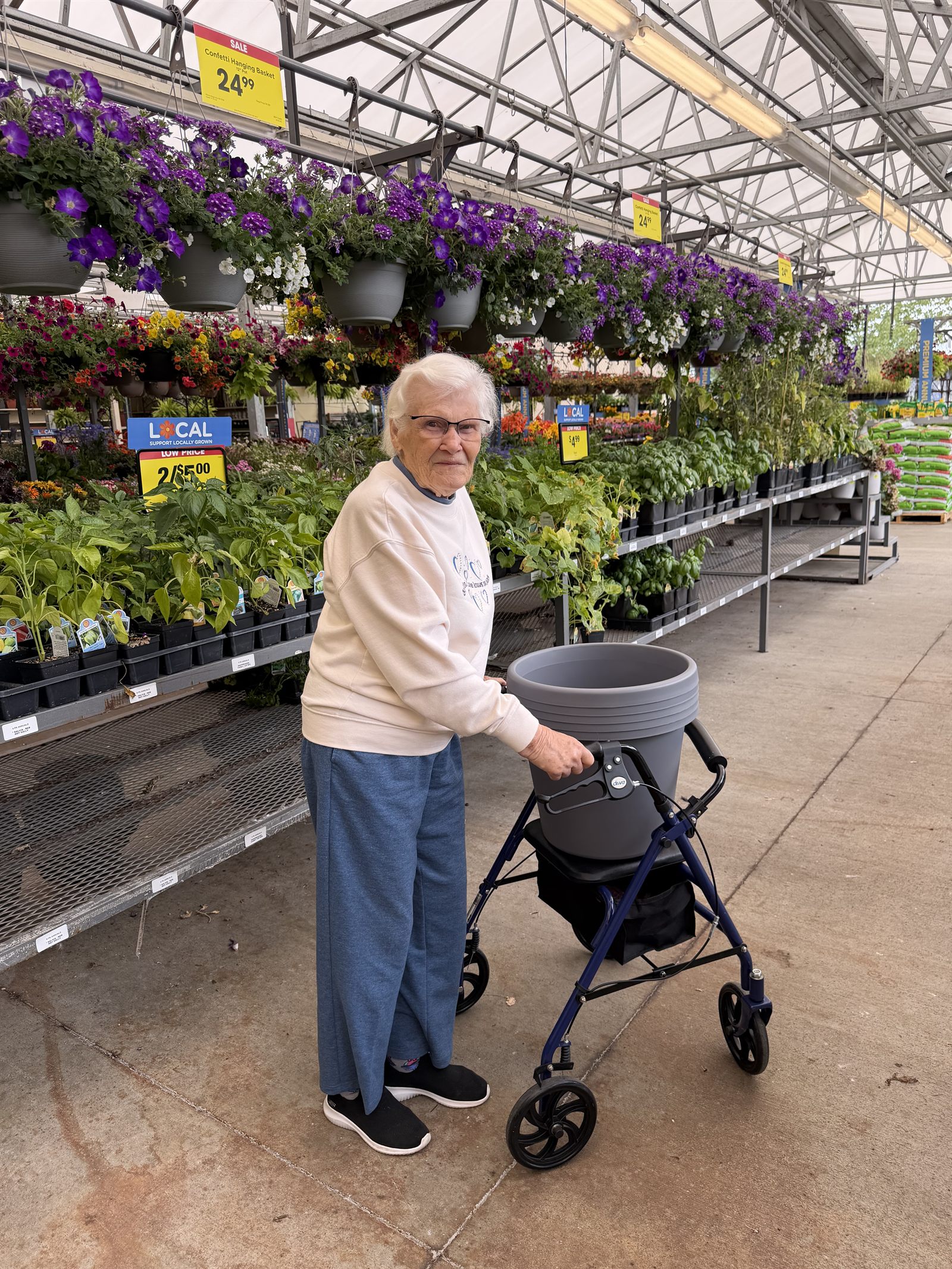 A resident choosing a planter at the garden centre